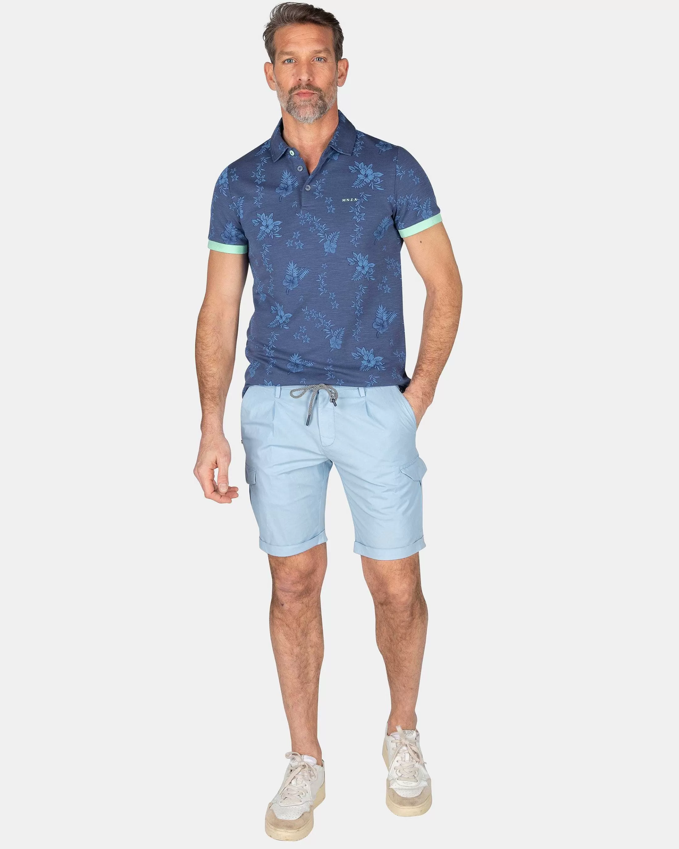 Shop NZA New Zealand Auckland Marineblaues Polo Mit Blumen-Dusk Navy